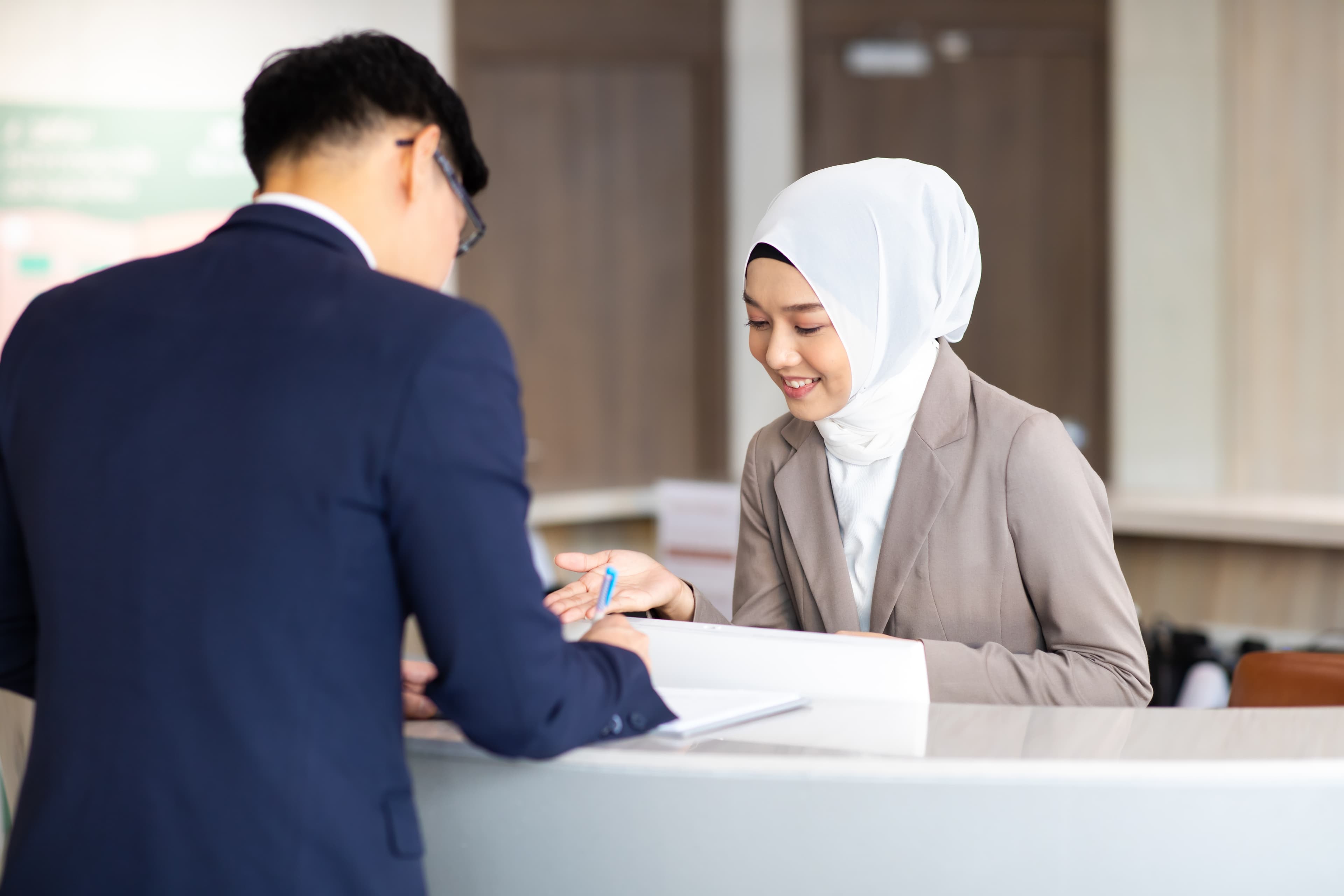 Staff member assisting a guest